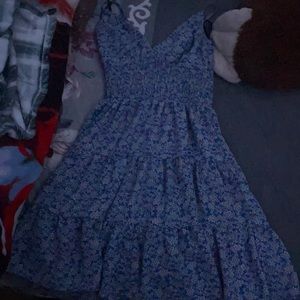 This dress is blue with flowers and is so nice.